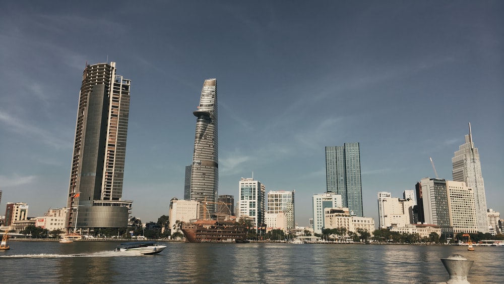 city skyline across body of water during daytime