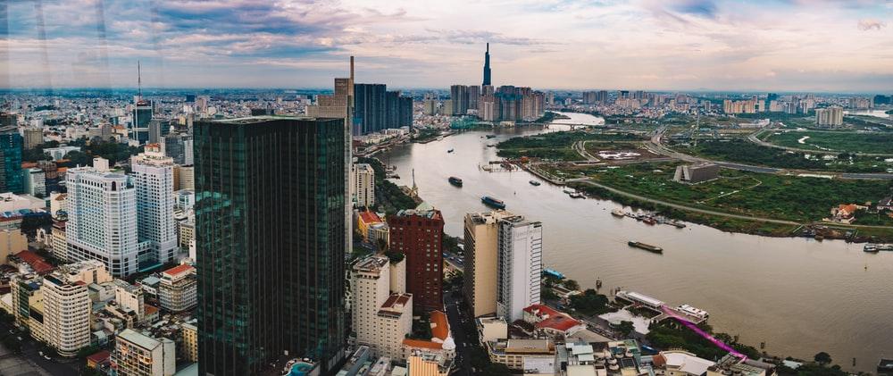 high rise buildings near body of water during daytime